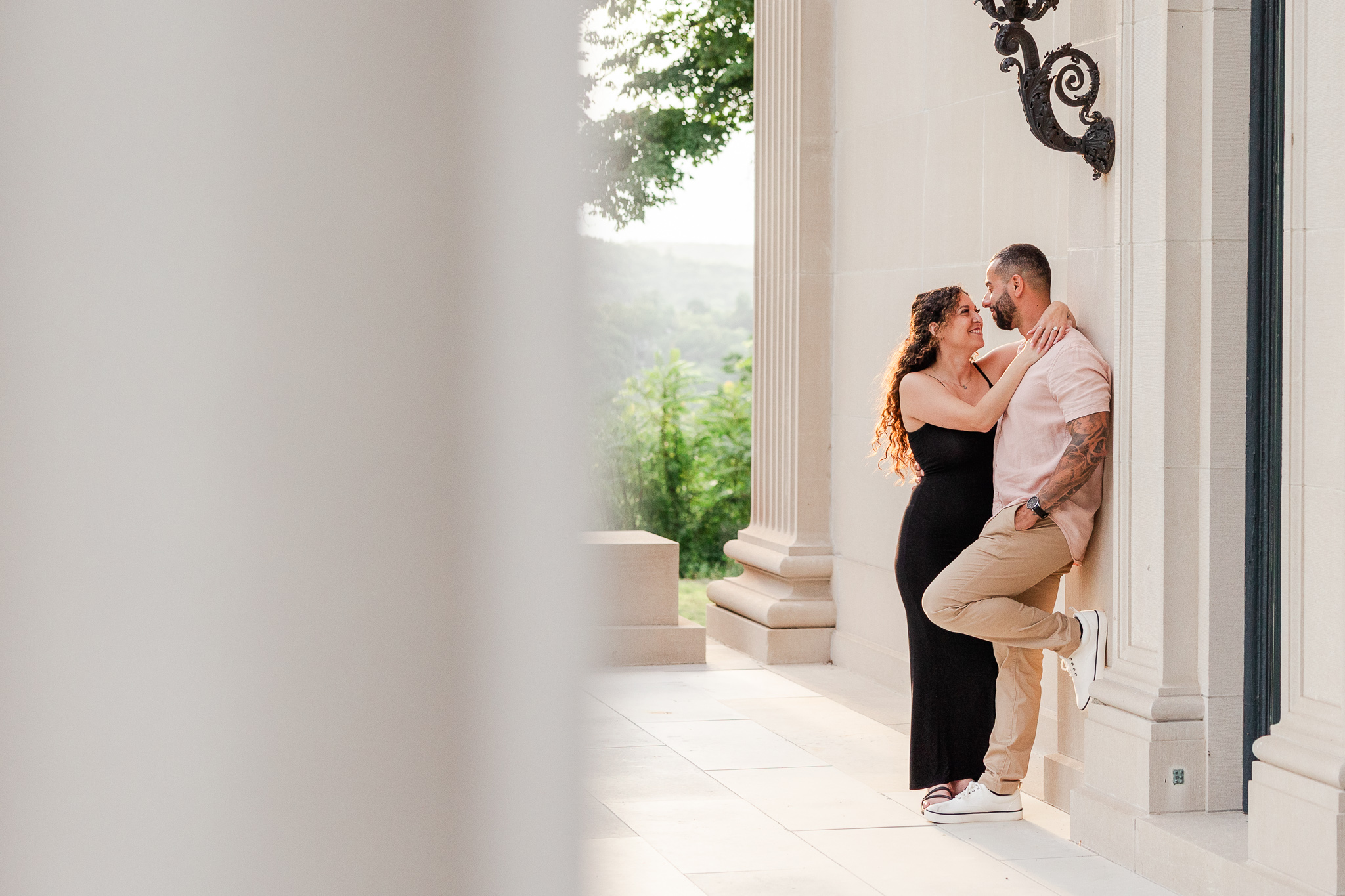 couple together on the porch at the Vanderbilt Mansion in Hyde Park NY